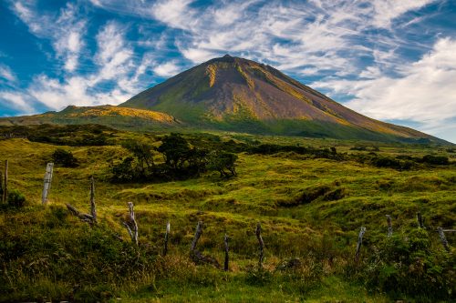 the-warm-coloured-evening-sun-gracing-the-volcanic-mount-pico-on-the-island-of-pico-azores-portugal